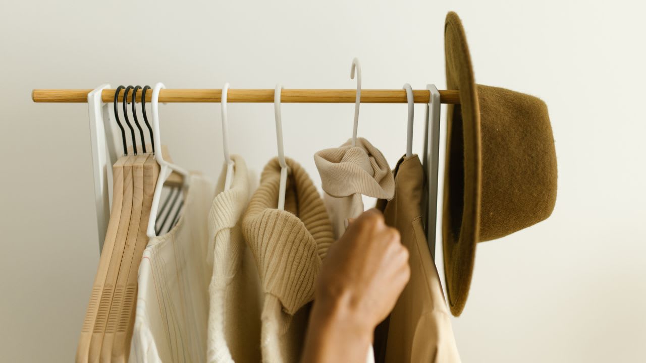 Hanging of Clothes on a Clothing Rack